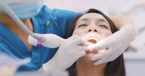 A woman getting a Periodontal cleaning procedure
